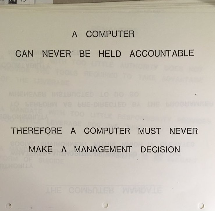 Printed slide, 'A computer can never be held accountable, therefore a computer must never make a management decision.'